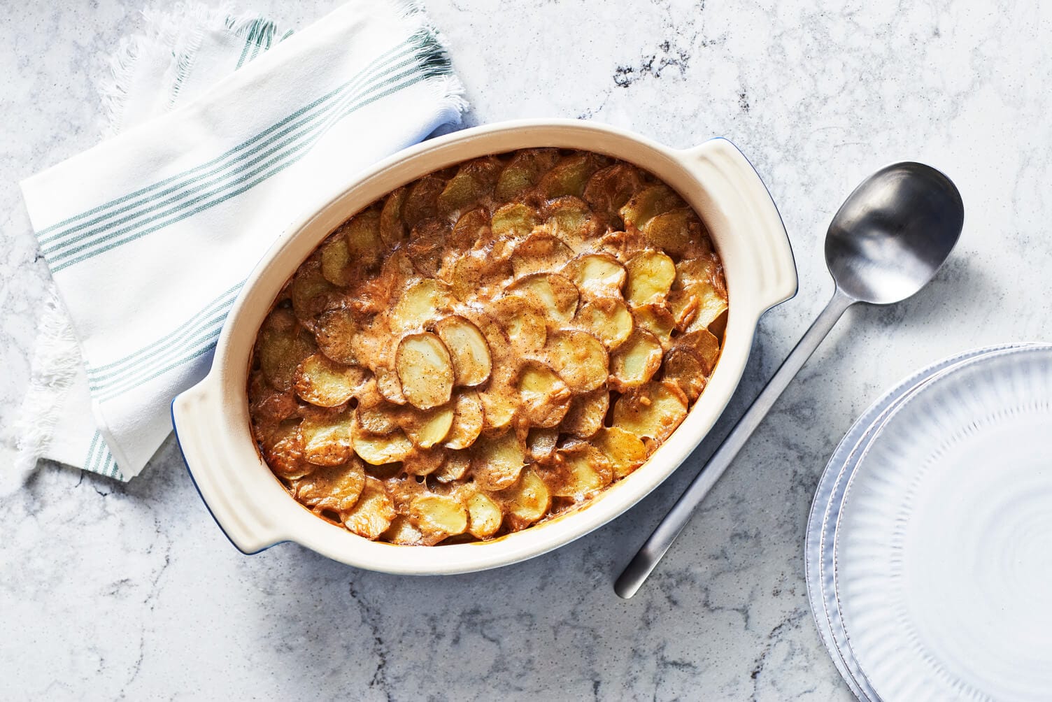 A casserole dish of basic scalloped potatoes.