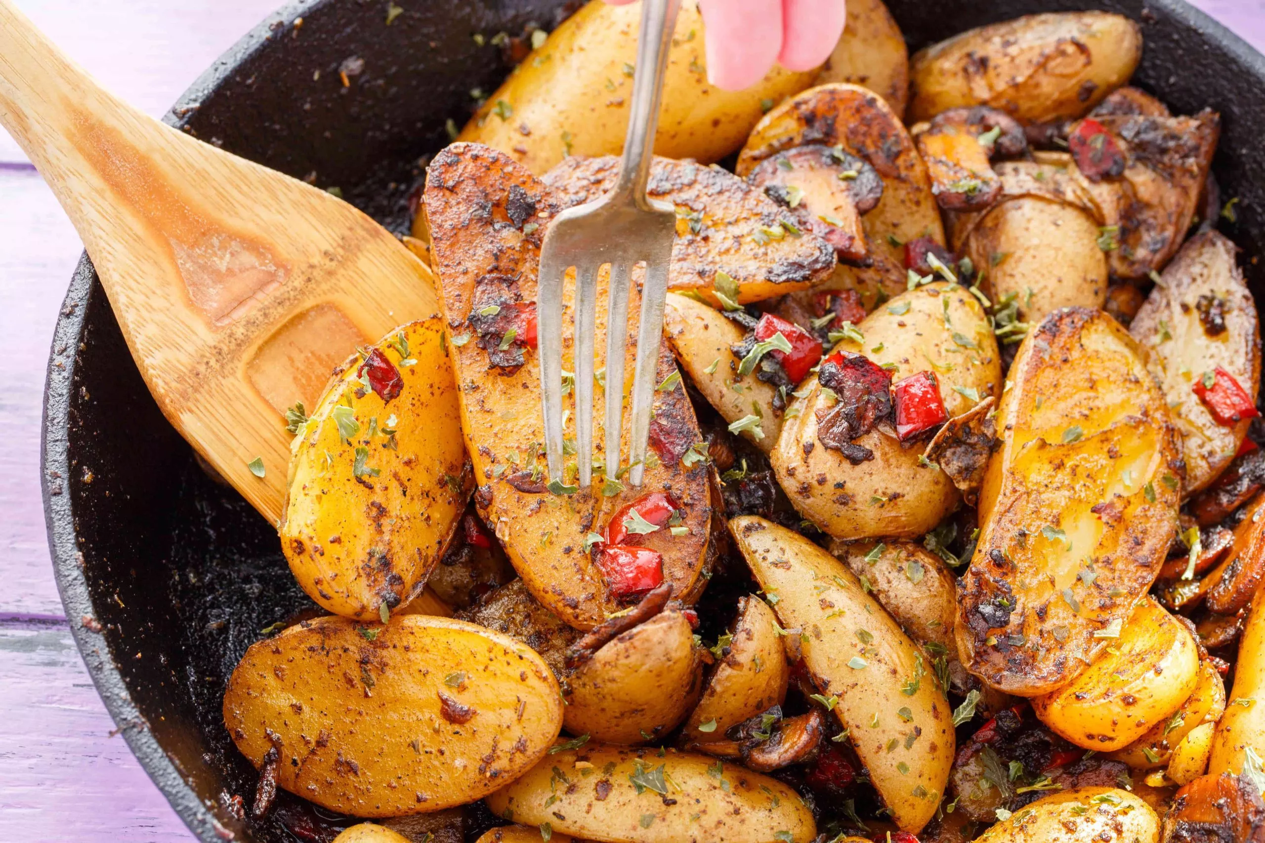 A cast iron skillet of breakfast home fries.