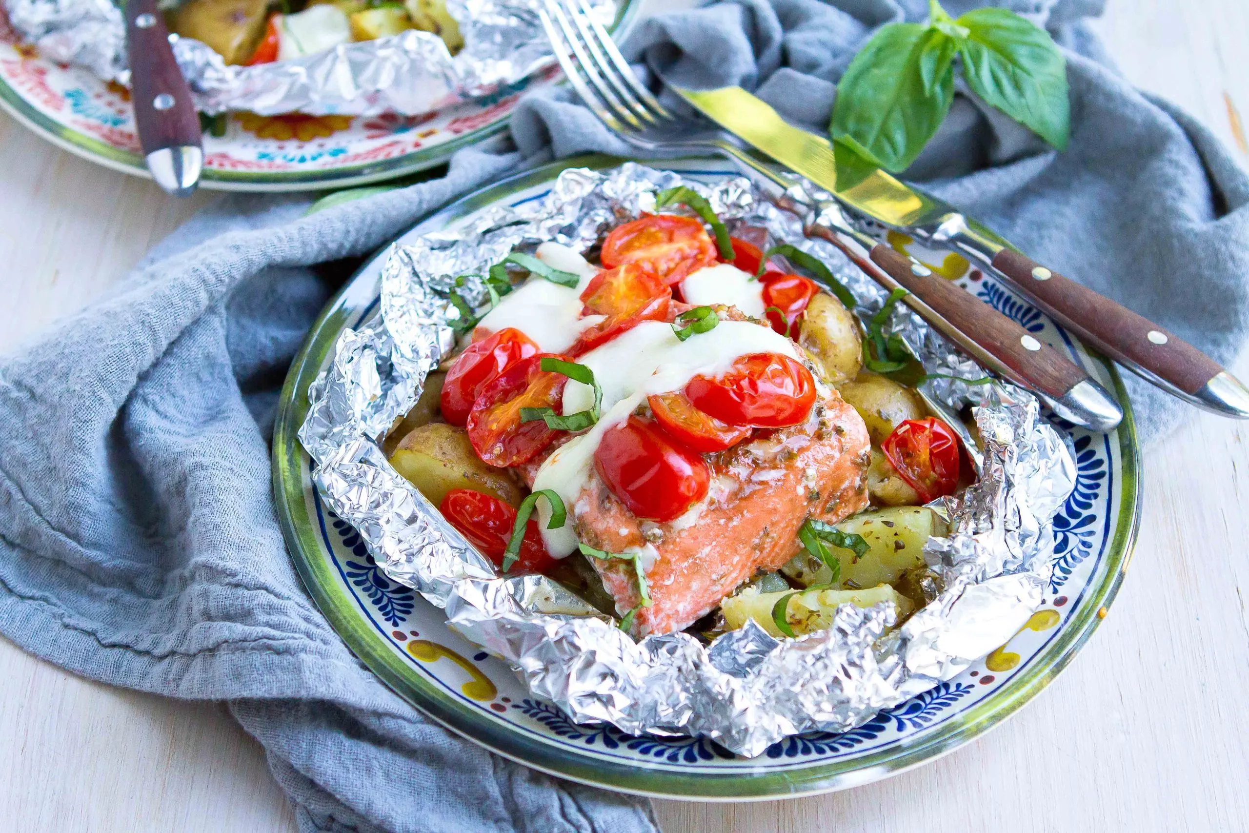Caprese salmon foil packets.