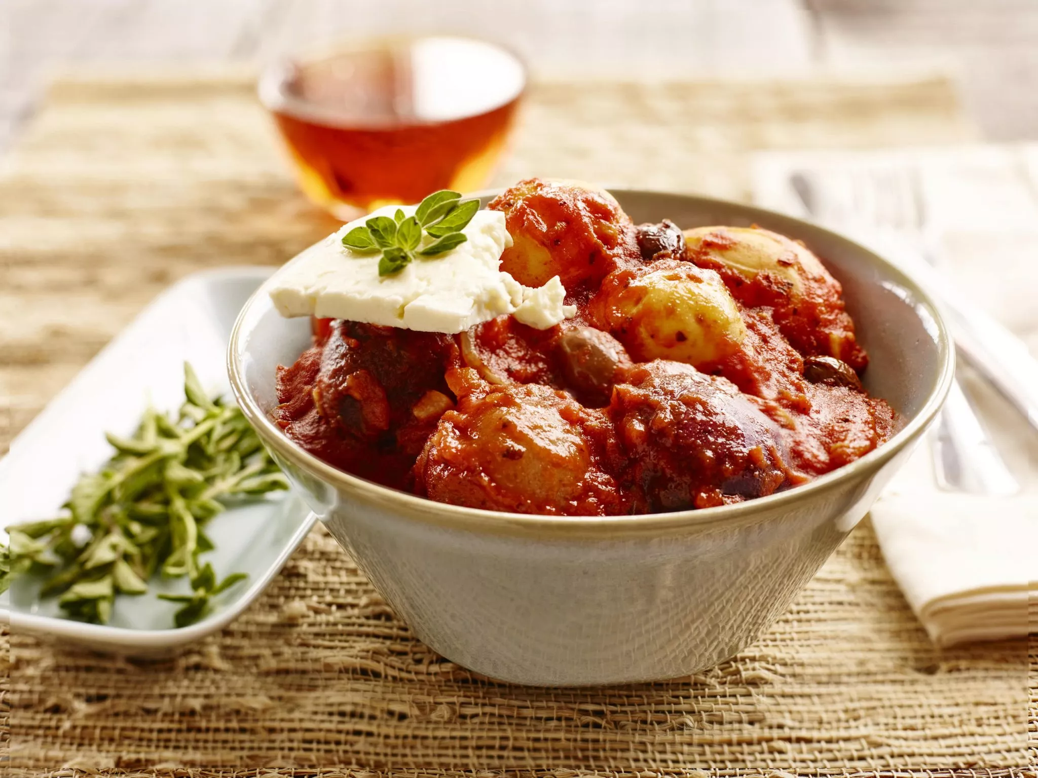 Warm little potato salad in a bowl.