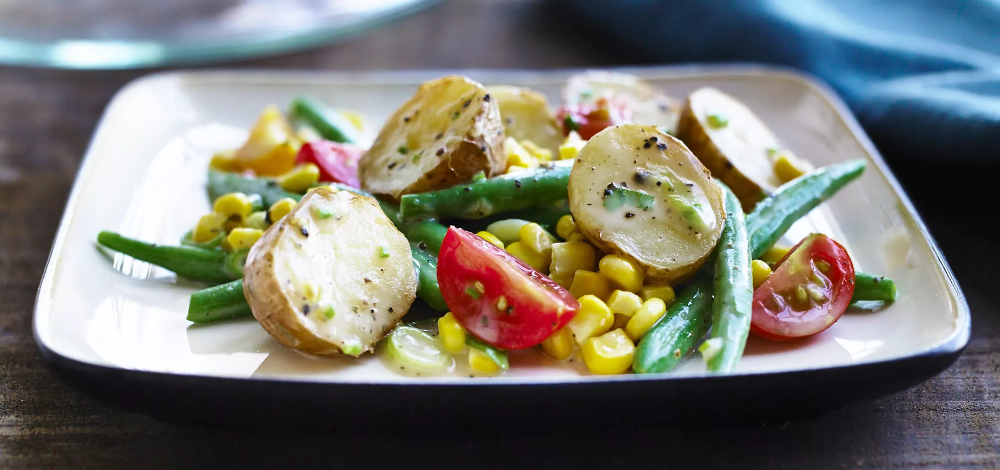 A plate of corn and tomato salad.