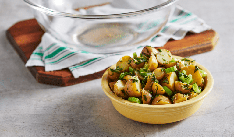 A bowl of lemon herb potato salad.