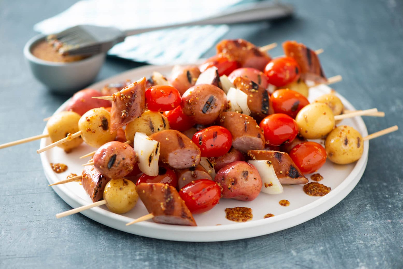A plate of little potato brat skewers.