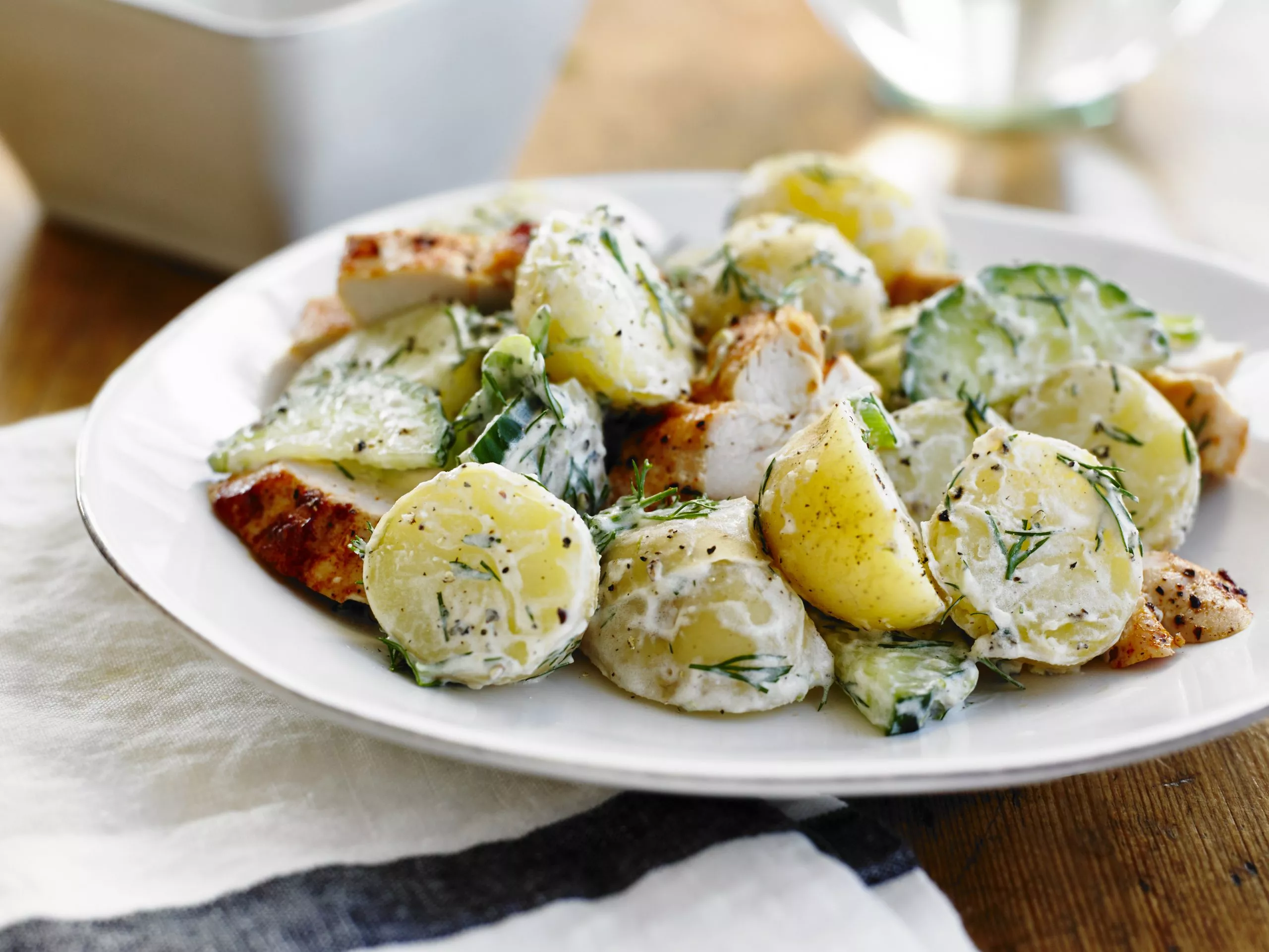Chicken breast with creamy dill potatoes and cucumber salad.