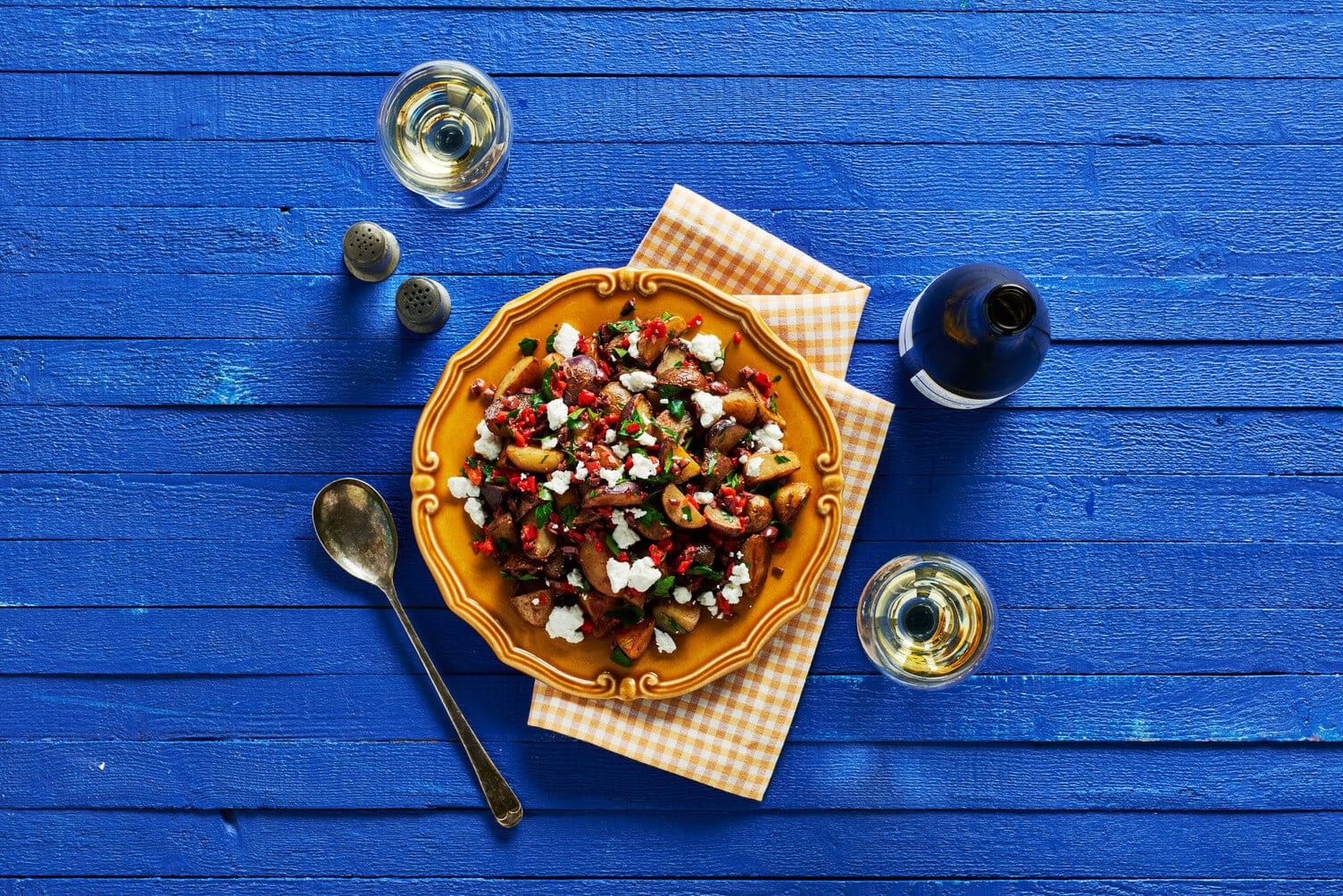 Olive oil and roasted red pepper little potatoes in a nice bowl.