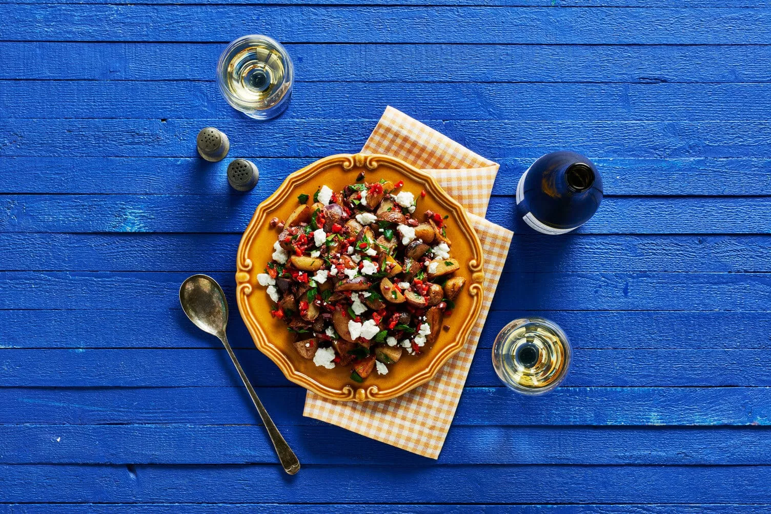 Olive oil and roasted red pepper little potatoes in a nice bowl.