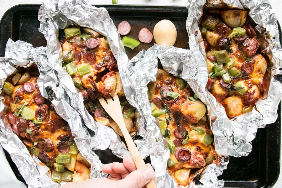 Foil packets full of pizza potatoes.