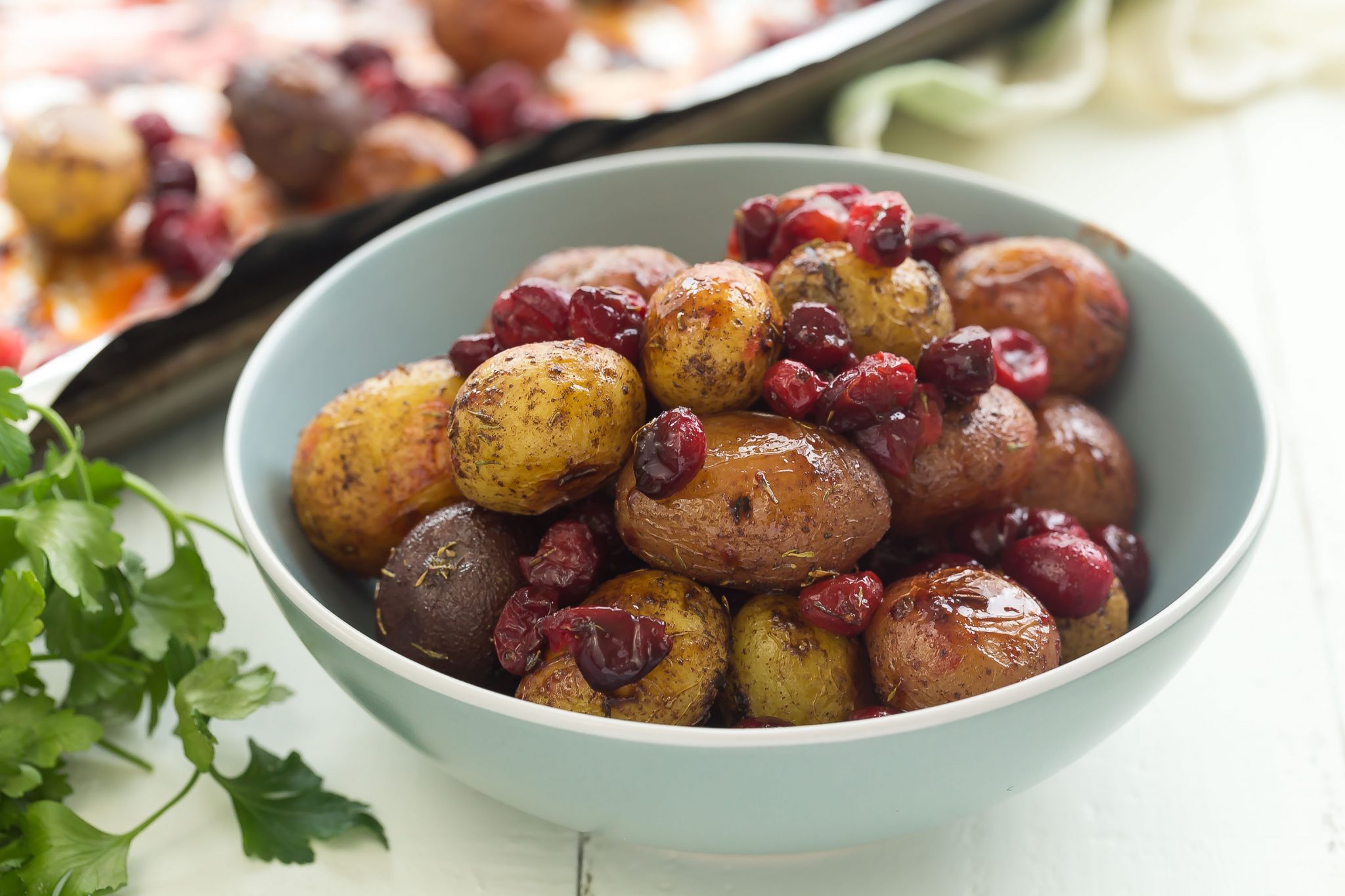Roasted little potatoes with cranberries and spices. A wonderful side dish for the holidays!