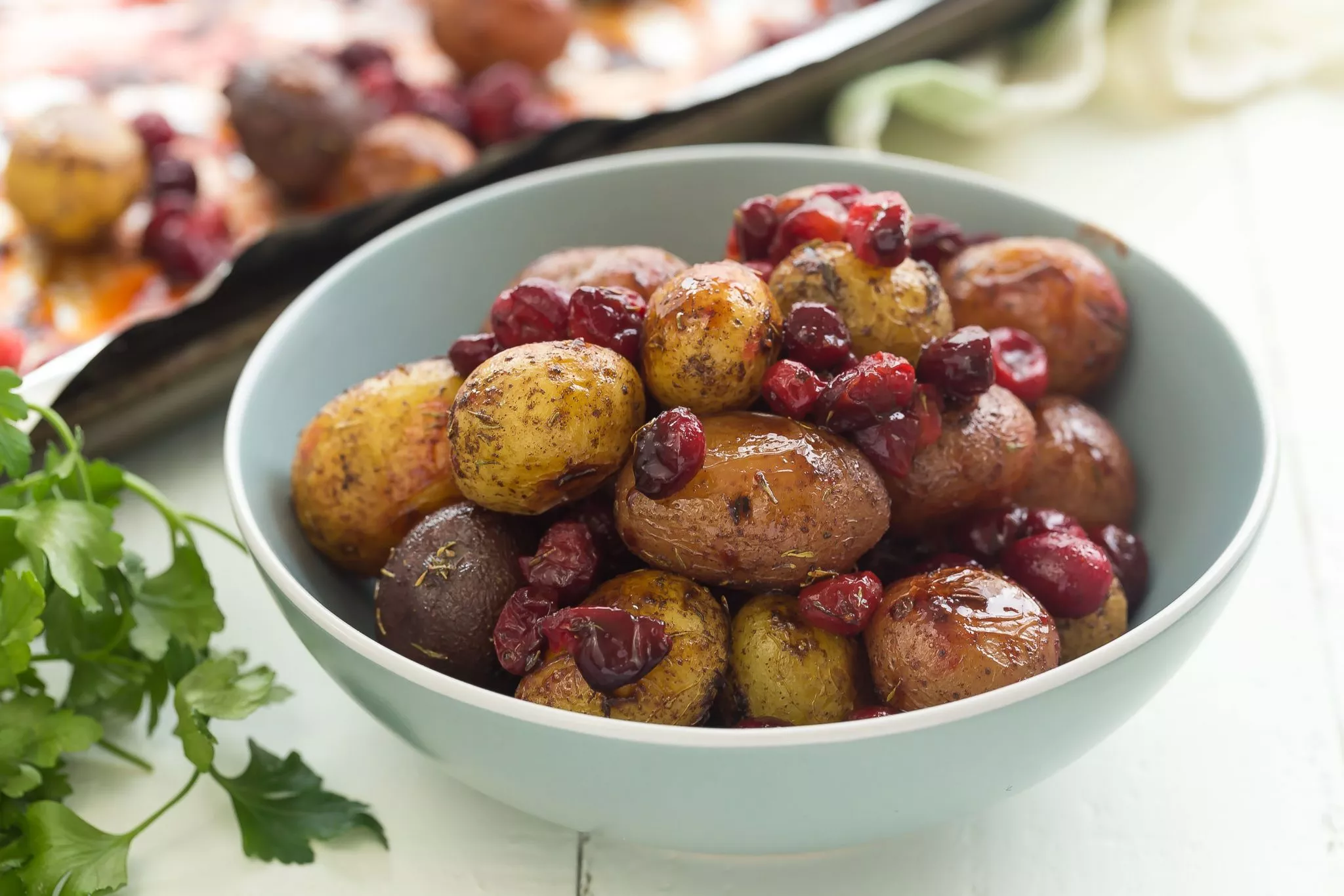 Roasted little potatoes with cranberries and spices. A wonderful side dish for the holidays!