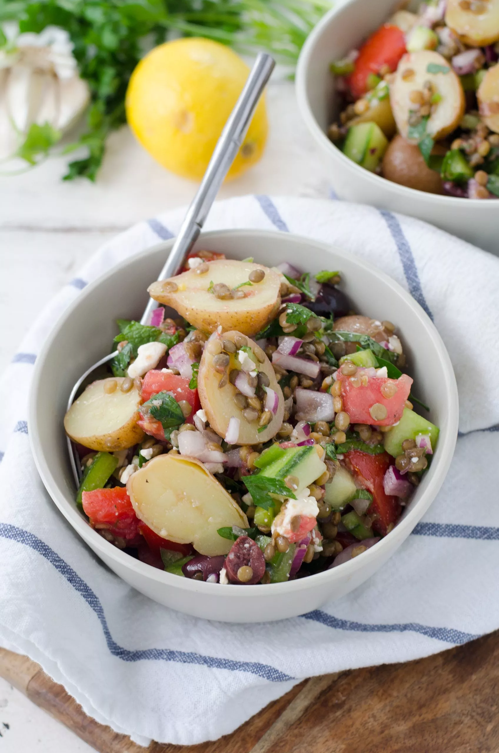 A bowl of Greek salad and lentils.